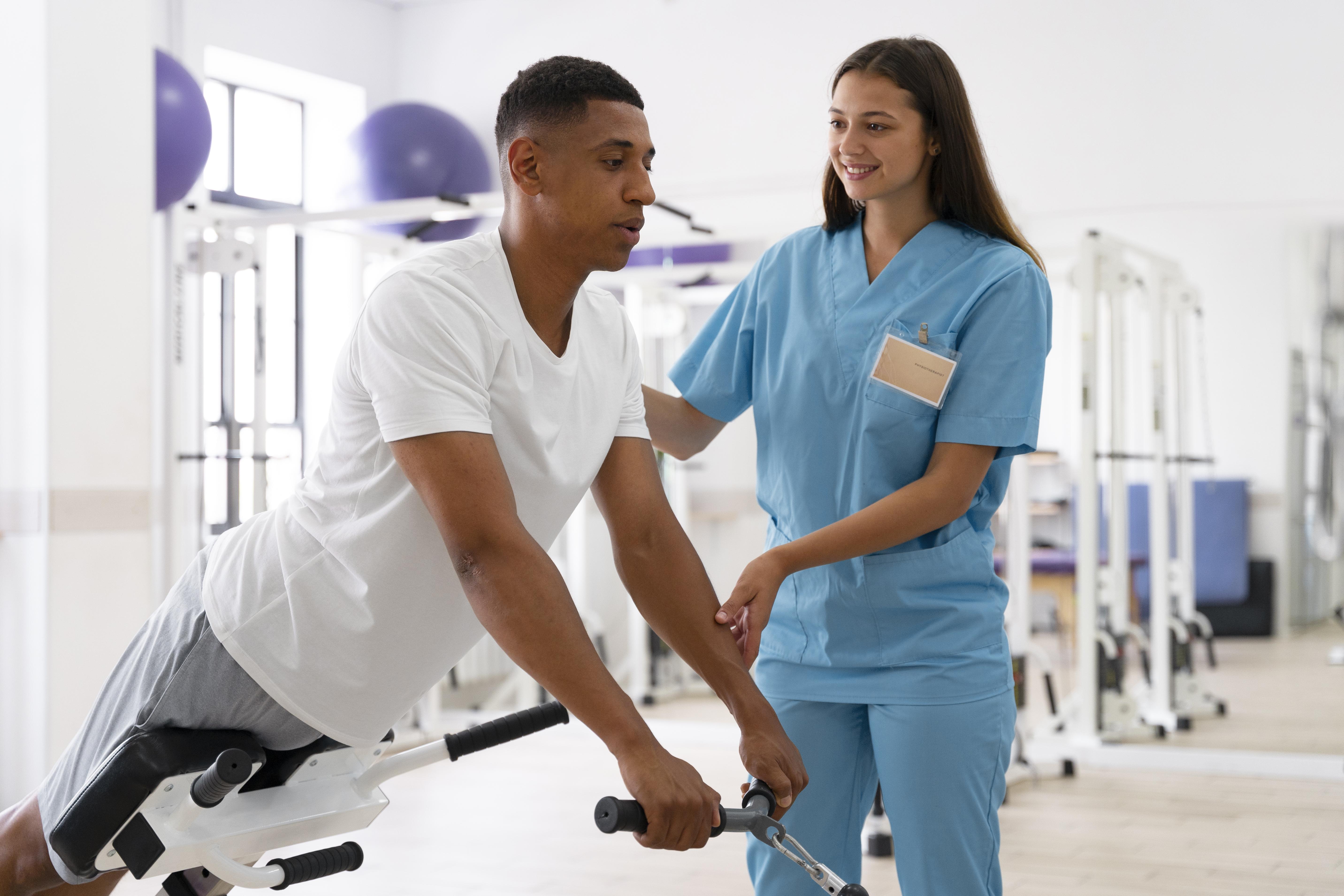 Healthcare professional helping patient