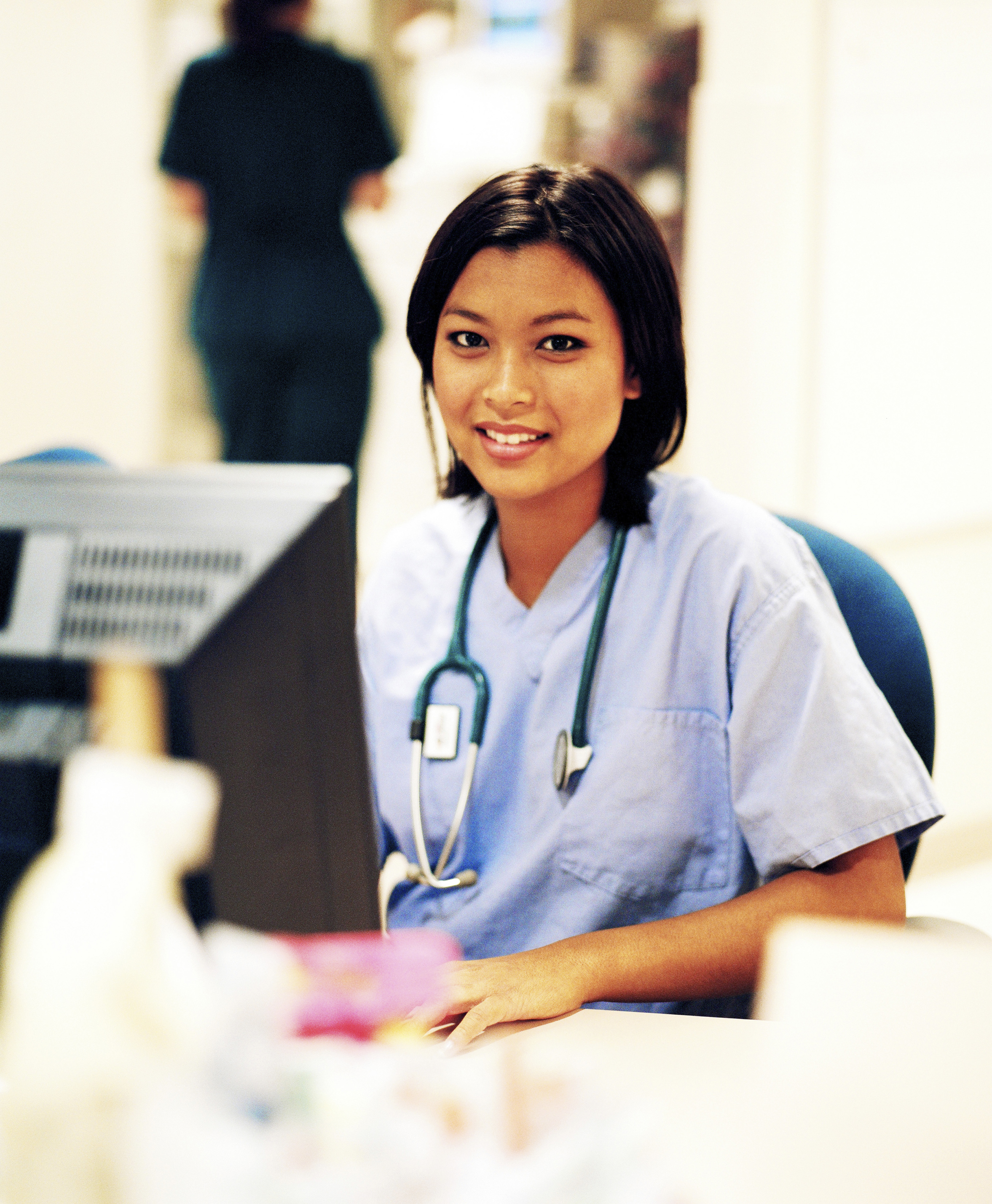 Medical professional working at computer